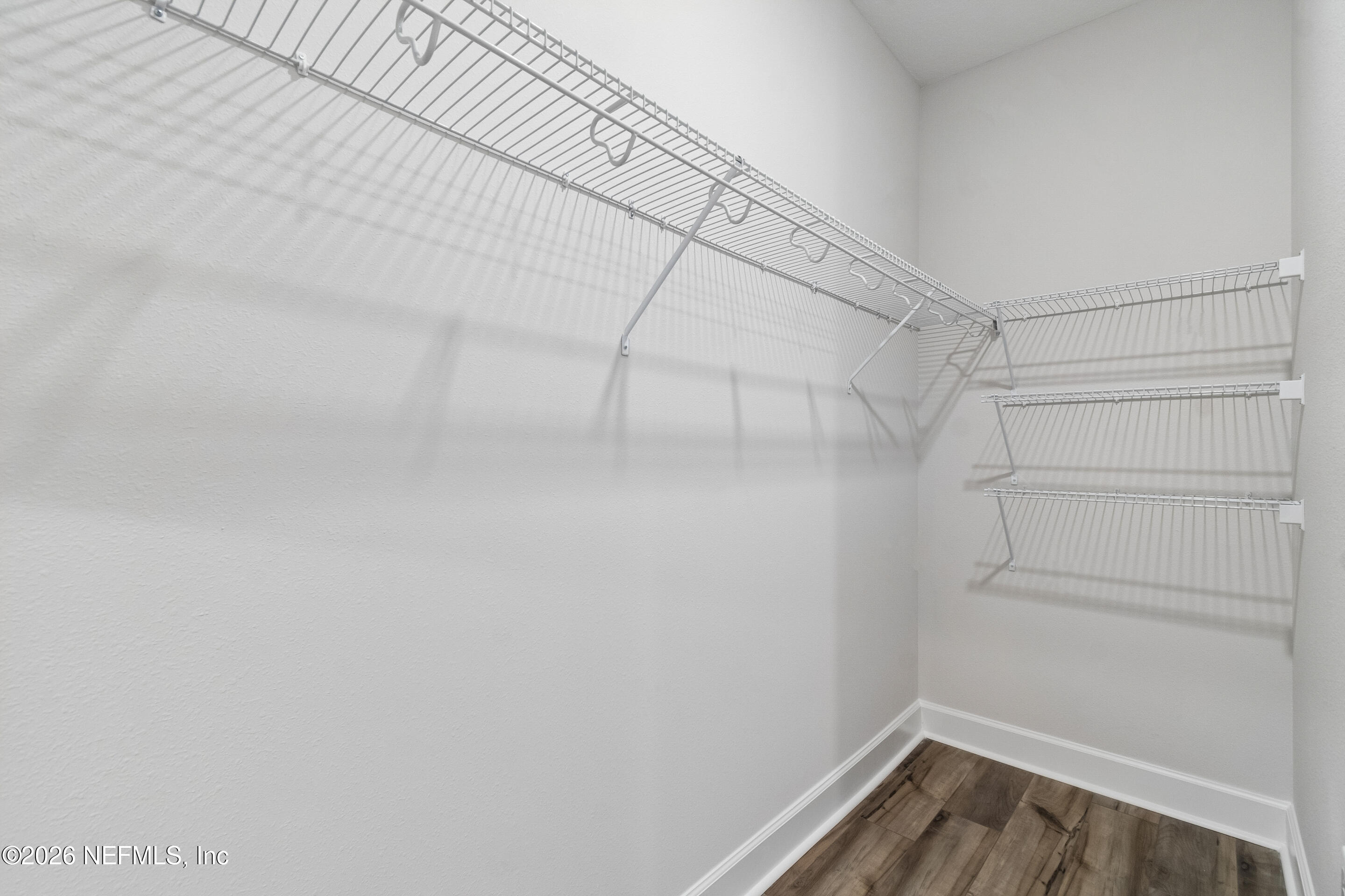 75751 Bayley Place Yulee, FL 32097 - Photo 25 of 28 a view of a room with racks on the wall