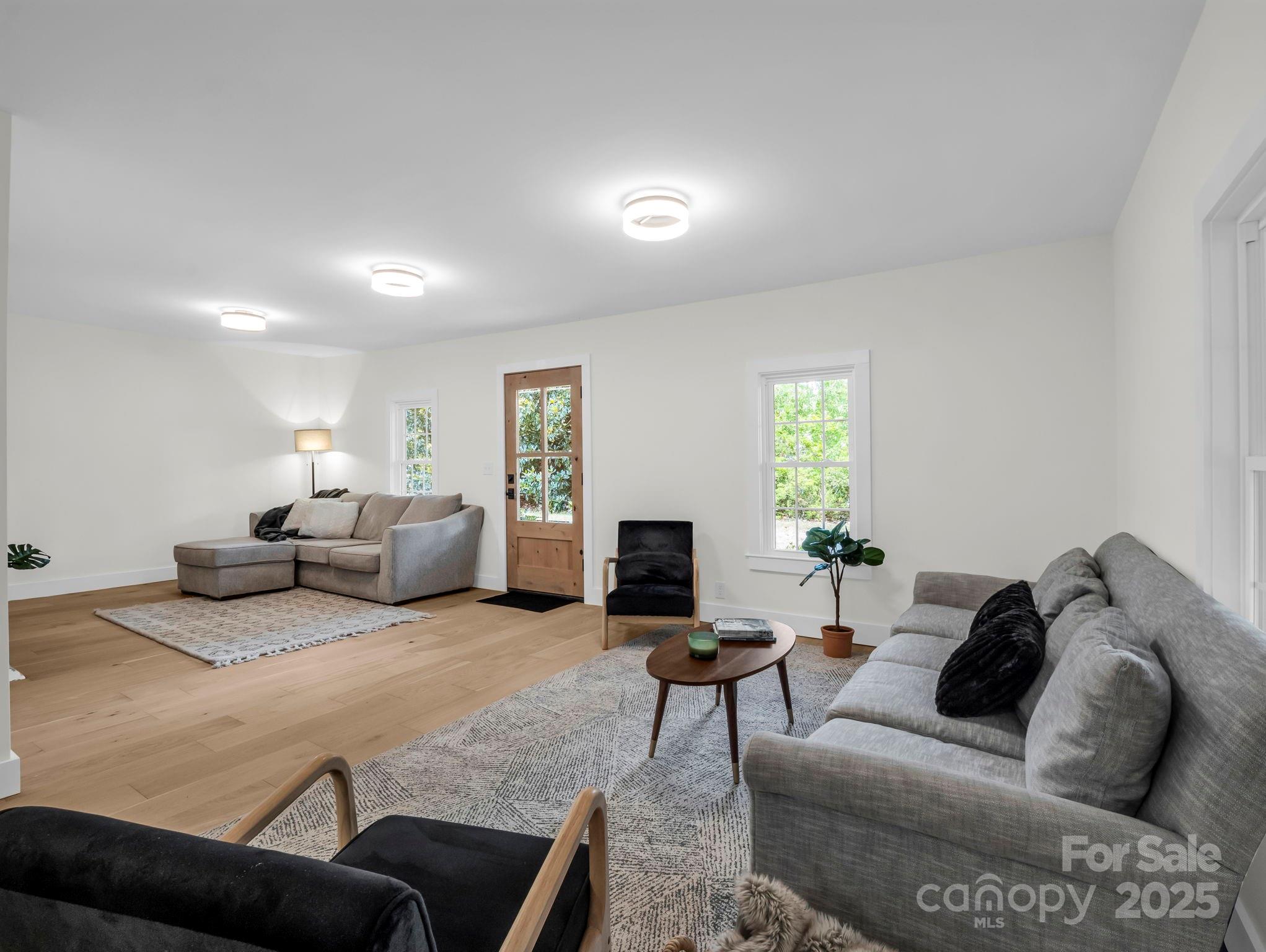 5990 South Nc 9 Highway Tryon, NC 28782 - Photo 12 of 42 a living room with furniture and a window