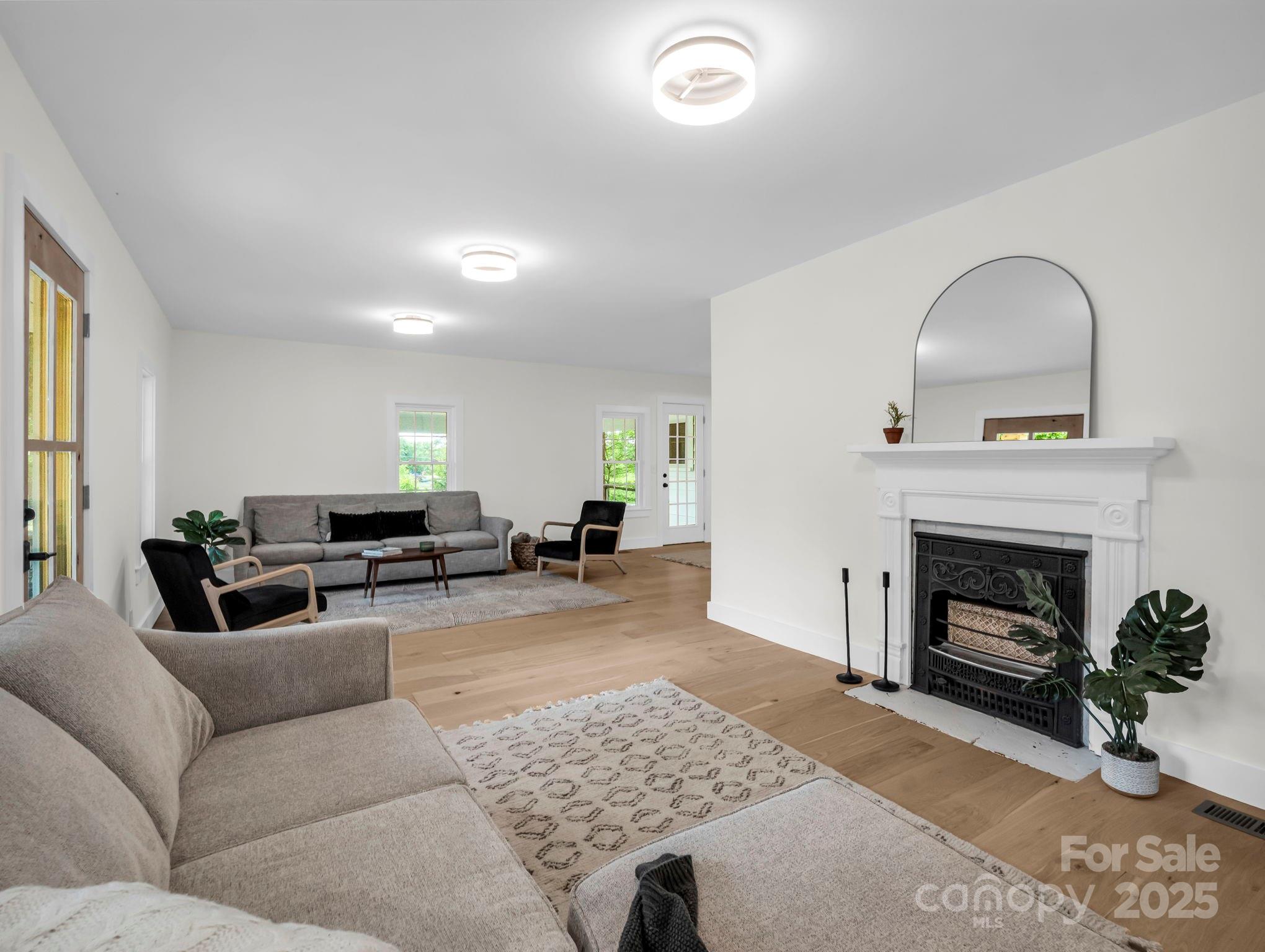 5990 South Nc 9 Highway Tryon, NC 28782 - Photo 13 of 42 a living room with furniture and a fireplace