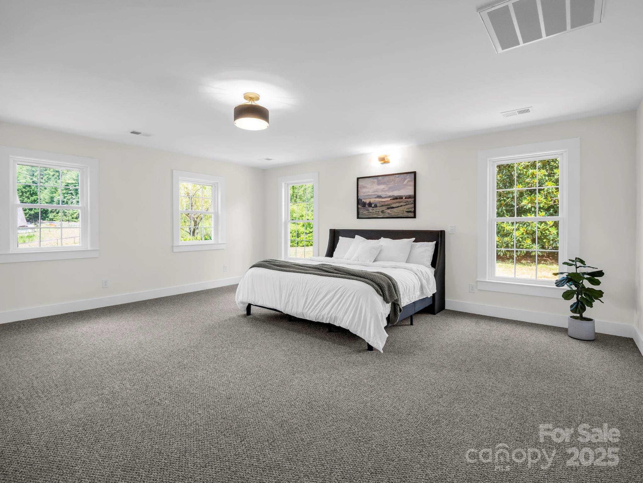 5990 South Nc 9 Highway Tryon, NC 28782 - Photo 20 of 42 a bedroom with a bed and a window