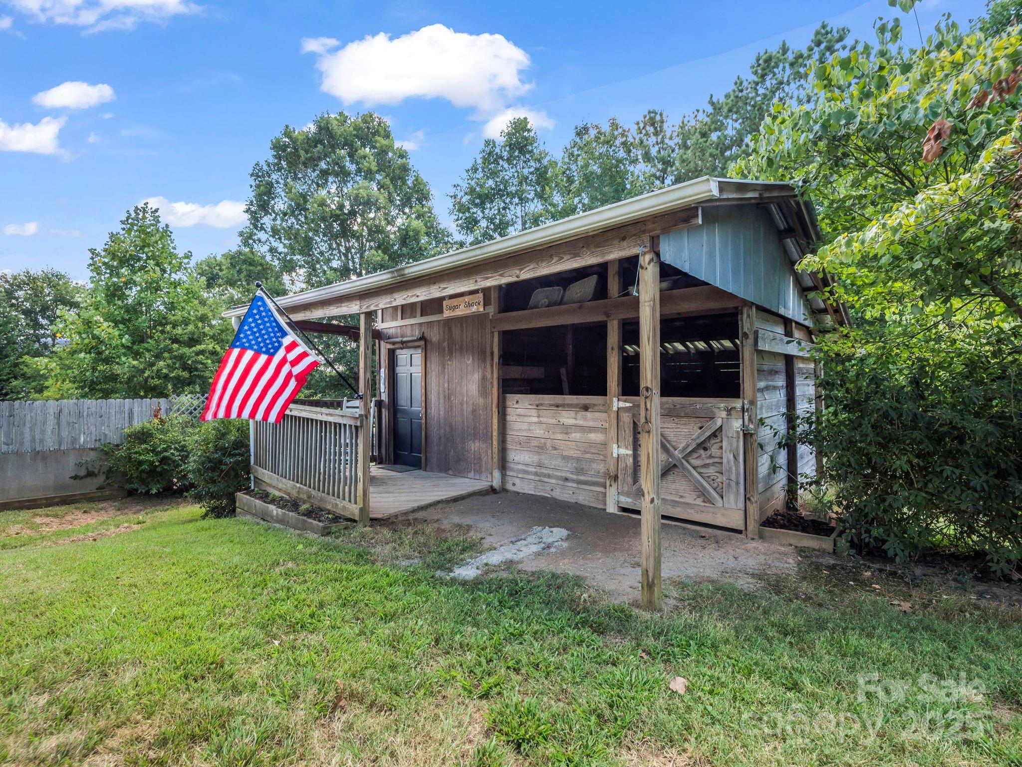 5990 South Nc 9 Highway Tryon, NC 28782 - Photo 3 of 42 a view of a barn with a yard