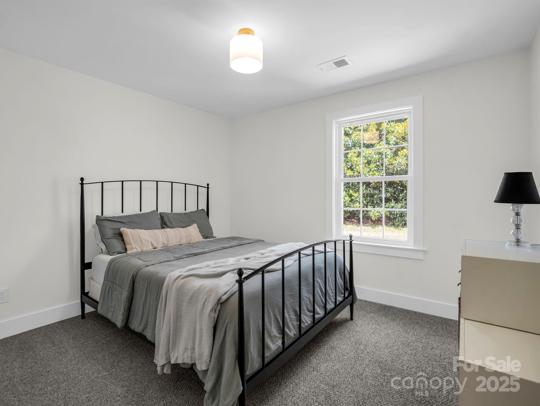 5990 South Nc 9 Highway Tryon, NC 28782 - Photo 34 of 42 a bedroom with a bed and window