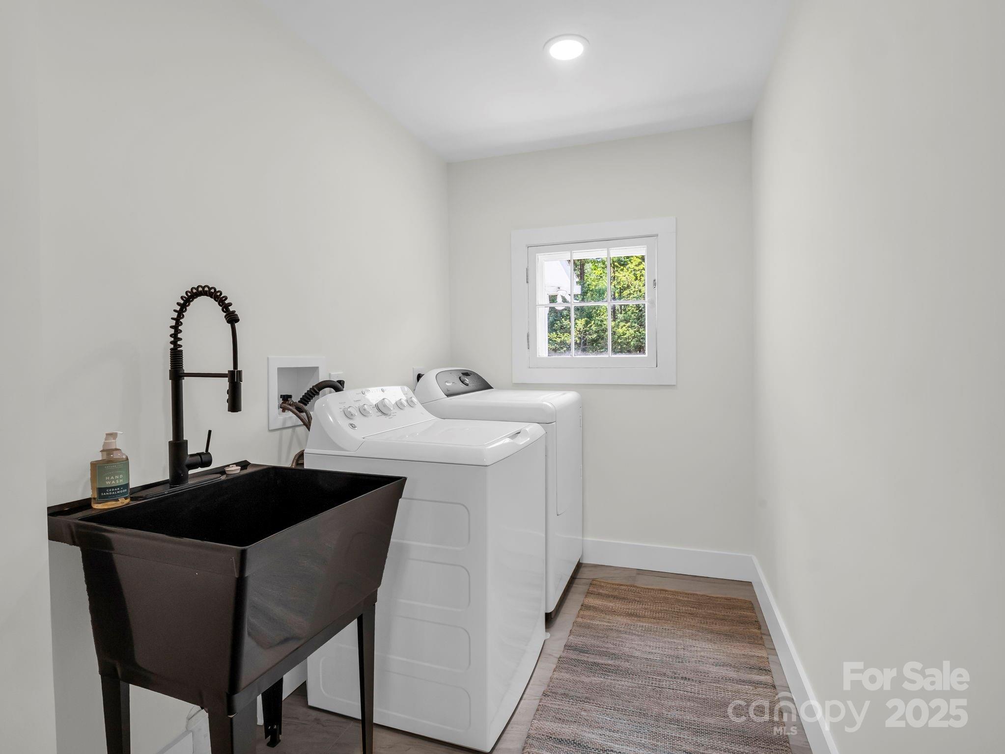 5990 South Nc 9 Highway Tryon, NC 28782 - Photo 36 of 42 a kitchen with a sink cabinets and a window