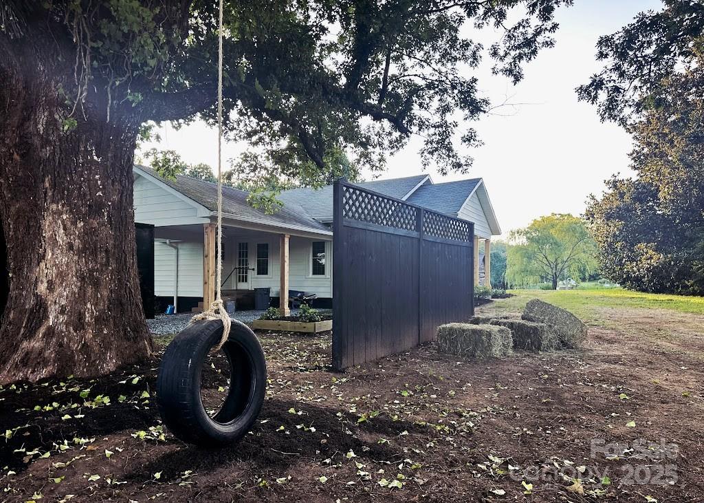 5990 South Nc 9 Highway Tryon, NC 28782 - Photo 37 of 42 a front view of a house with garden