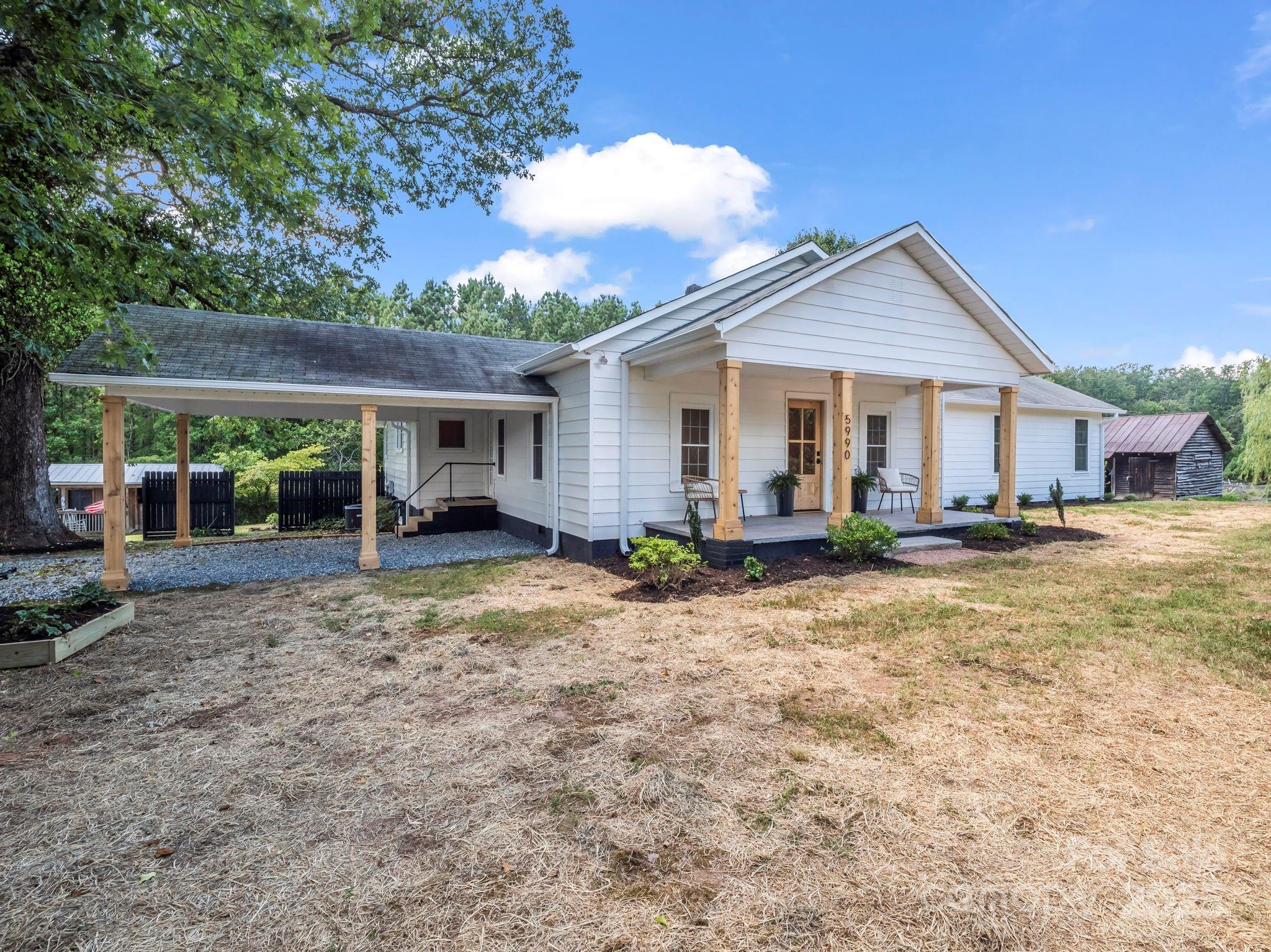 5990 South Nc 9 Highway Tryon, NC 28782 - Photo 38 of 42 a view of a house with backyard and porch
