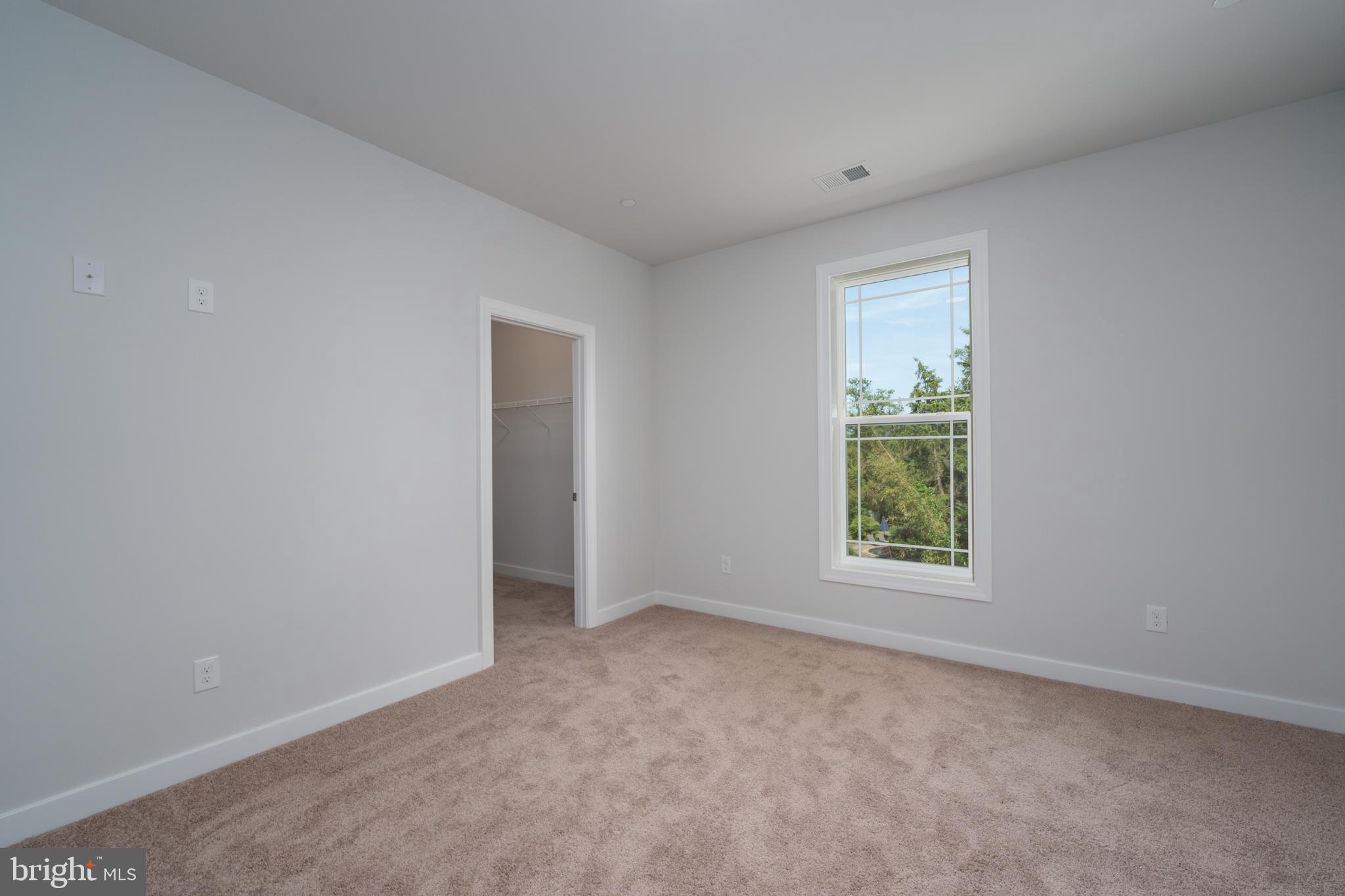 8118 Quarterfield Road Severn, MD 21144 - Photo 22 of 29 an empty room with windows