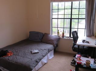 2300 Leon Street, Unit 302 Austin, TX 78705 - Photo 1 of 2 a bedroom with a bed and a window