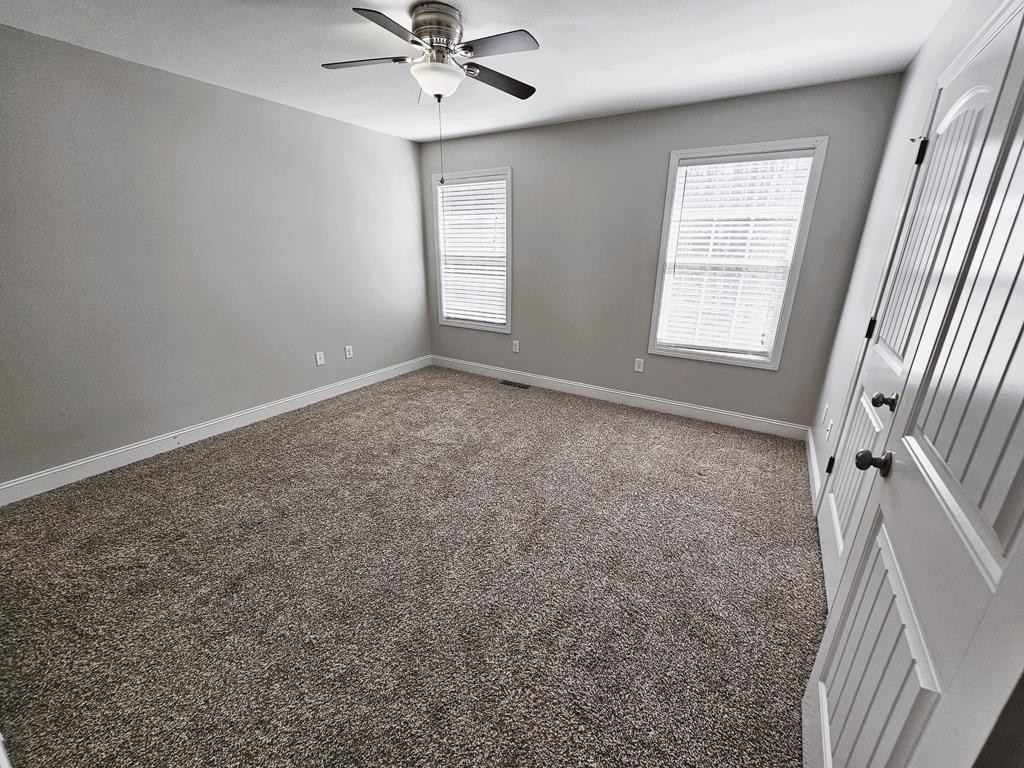 4835 Cameron Road Morristown, TN 37814 - Photo 10 of 25 an empty room with windows and fan