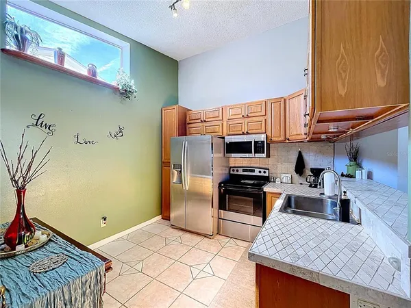 a bedroom with a bed lamps and a dresser