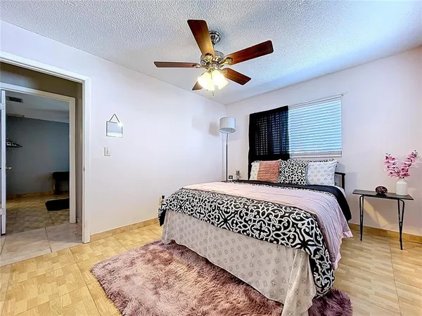 a living room with furniture rug and lamp