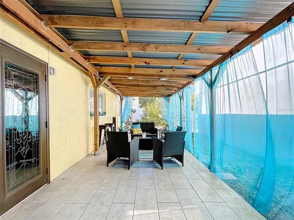 a view of a porch with wooden floor