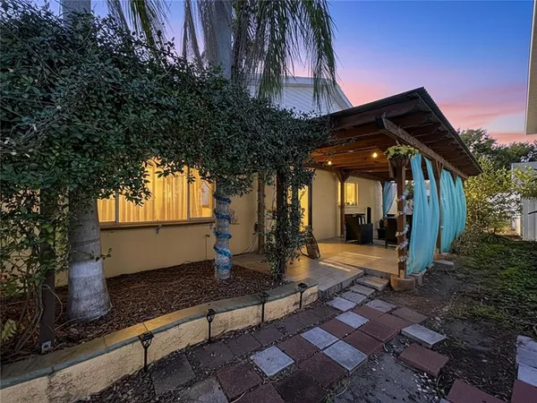 an aerial view of residential houses with city view