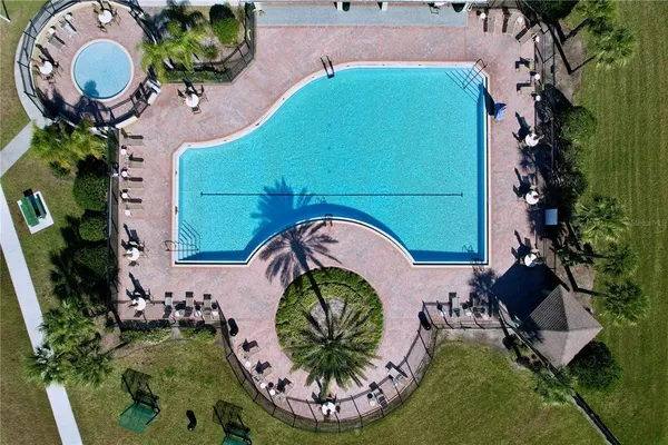 an aerial view of a swimming pool and porch