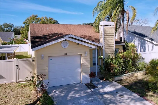 a view of a house with a yard