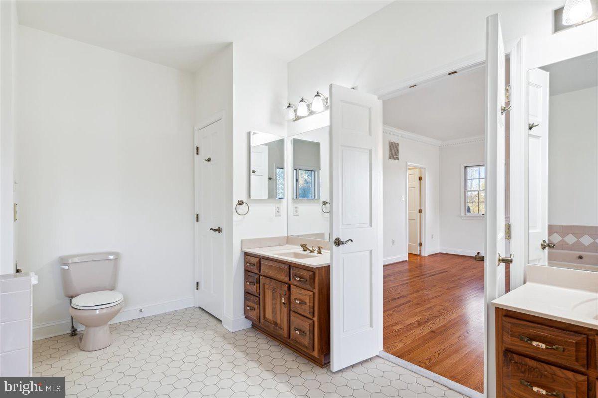 7130 Ira Sears Road Adamstown, MD 21710 - Photo 28 of 70 Double doors and tile in the primary bathroom.