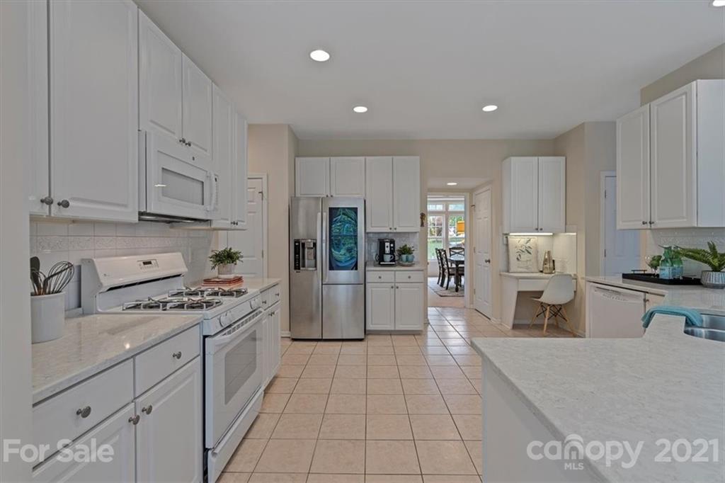 6616 Elfreda Road Charlotte, NC 28270 - Photo 14 of 37 a kitchen with cabinets and appliances
