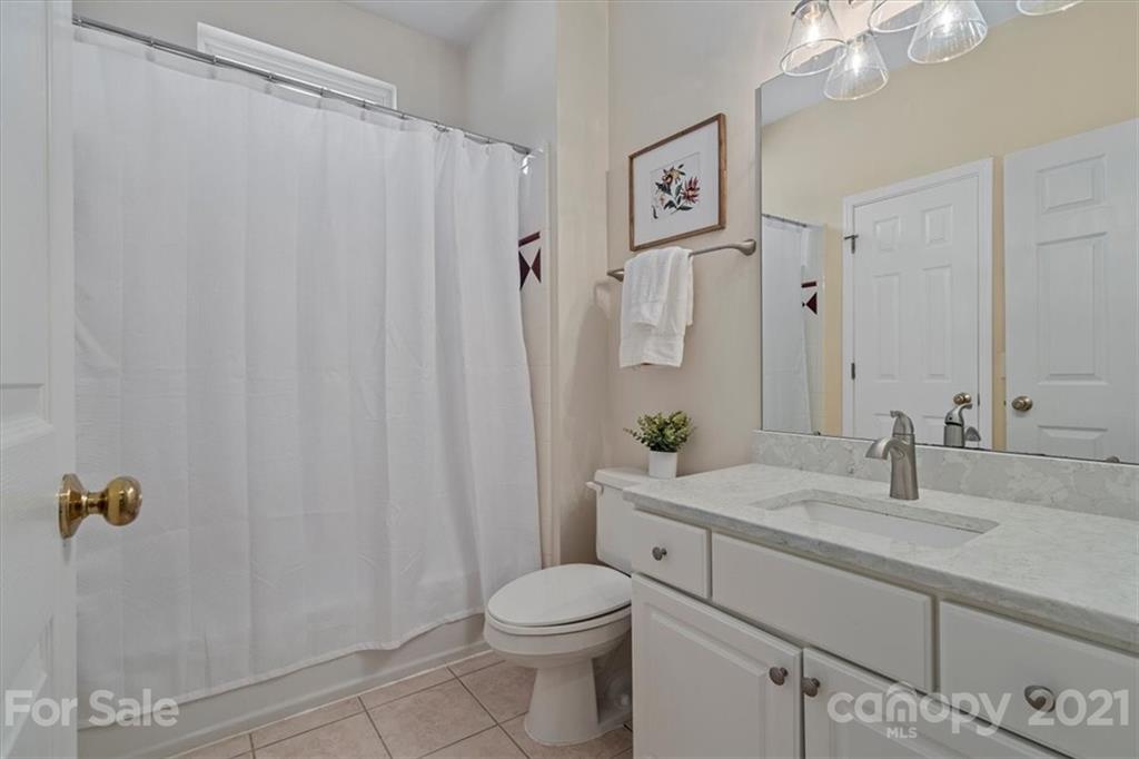 6616 Elfreda Road Charlotte, NC 28270 - Photo 20 of 37 a bathroom with a sink a toilet and shower