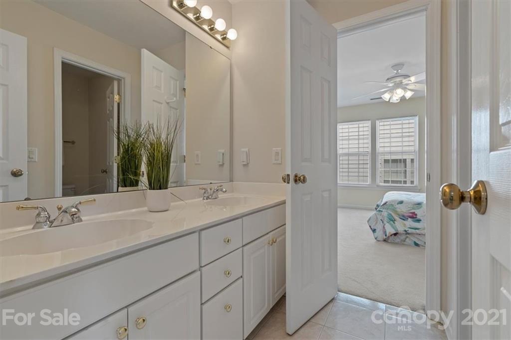 6616 Elfreda Road Charlotte, NC 28270 - Photo 25 of 37 a bathroom with a sink double vanity and mirror