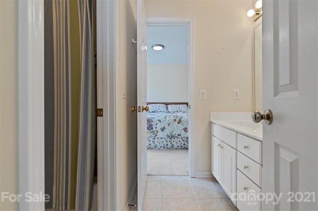 6616 Elfreda Road Charlotte, NC 28270 - Photo 26 of 37 a bathroom with a double vanity sink and mirror