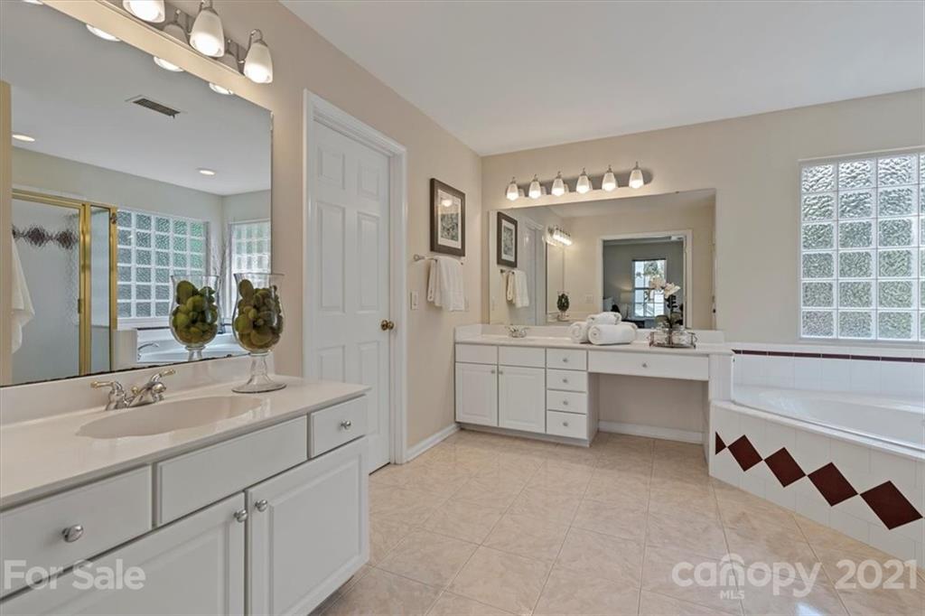 6616 Elfreda Road Charlotte, NC 28270 - Photo 30 of 37 a bathroom with a double vanity sink mirror and bathtub