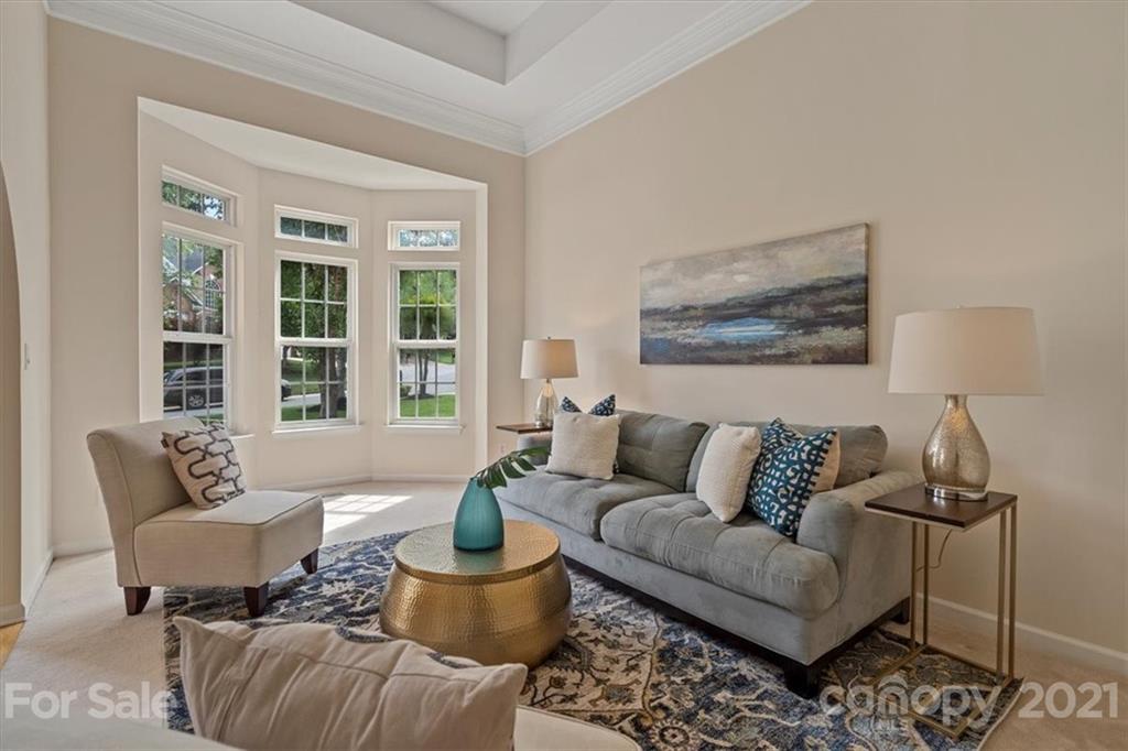 6616 Elfreda Road Charlotte, NC 28270 - Photo 7 of 37 a living room with furniture and a large window