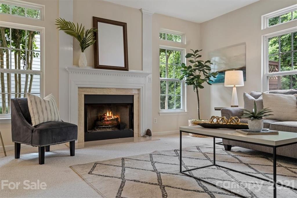 6616 Elfreda Road Charlotte, NC 28270 - Photo 9 of 37 a living room with furniture and a fireplace