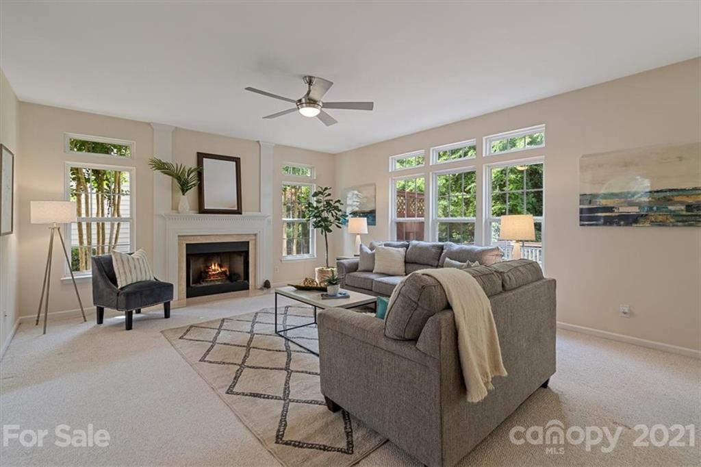 6616 Elfreda Road Charlotte, NC 28270 - Photo 10 of 37 a living room with furniture and a fireplace