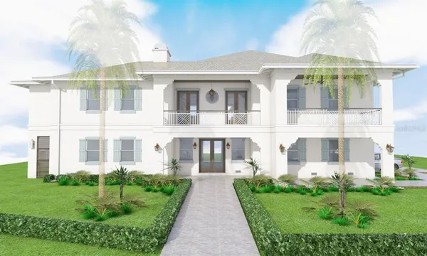 front view of a brick house with a yard