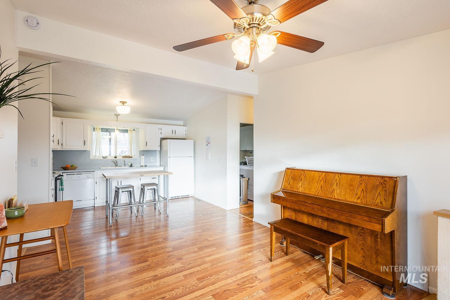 6403 Colonial Drive Boise, ID 83709 - Photo 15 of 42 Living area with light wood finished floors and ceiling fan