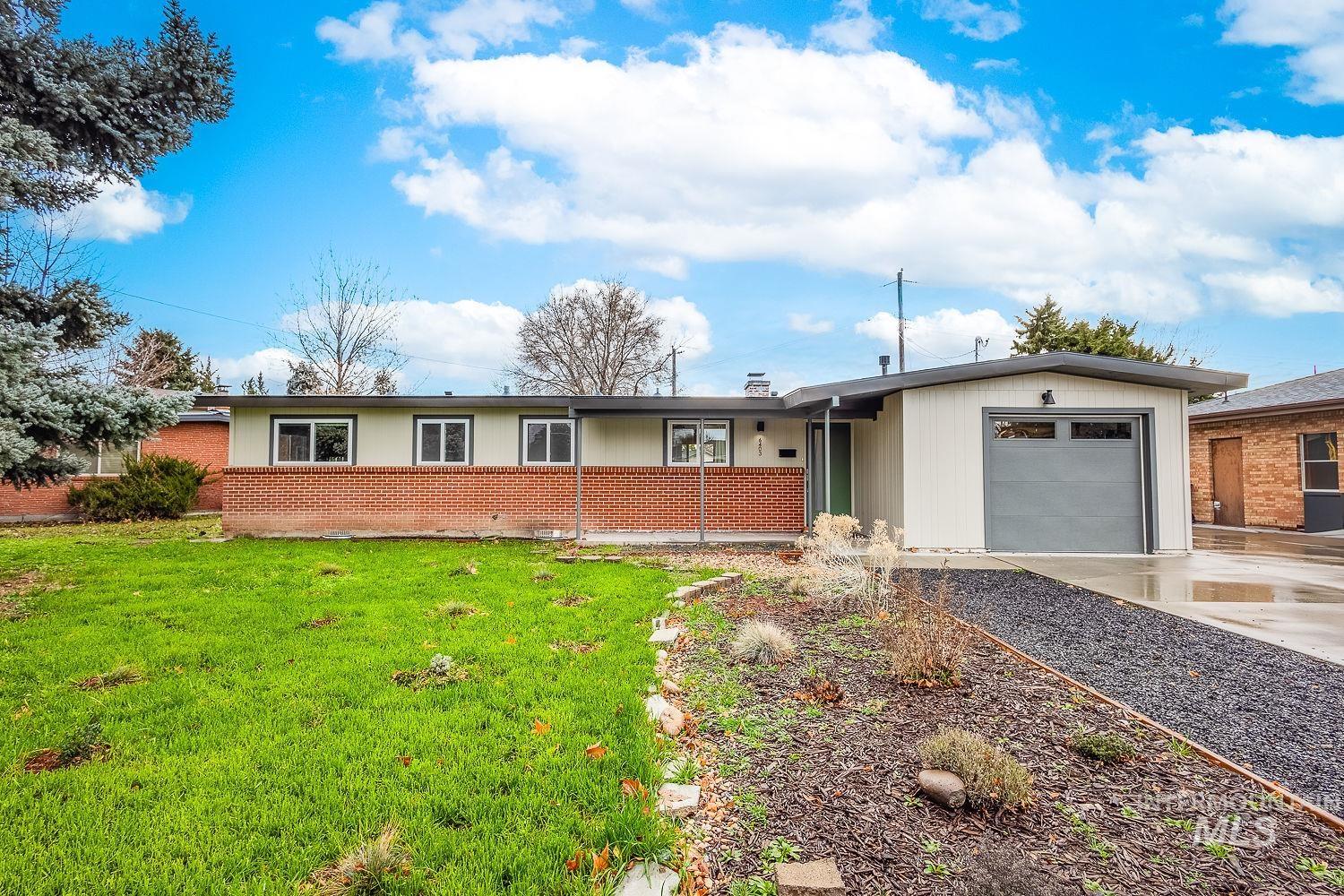 6403 Colonial Drive Boise, ID 83709 - Photo 2 of 42 Ranch-style home with a garage, a front yard, driveway, and brick siding