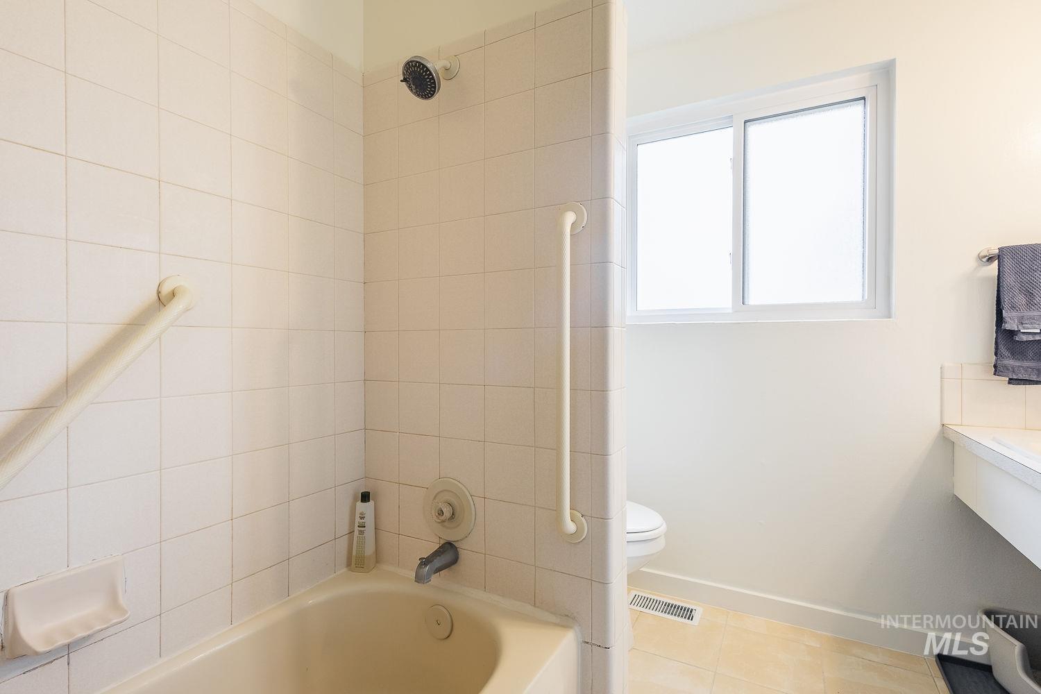 6403 Colonial Drive Boise, ID 83709 - Photo 24 of 42 Full bathroom with vanity, tile patterned floors, and shower / tub combination