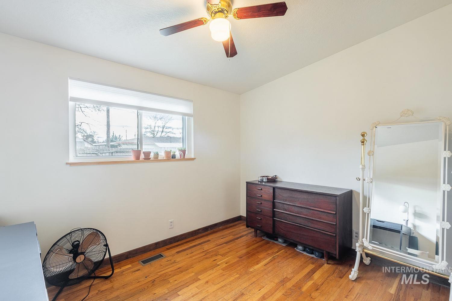 6403 Colonial Drive Boise, ID 83709 - Photo 25 of 42 Bedroom with a ceiling fan and light wood-style floors