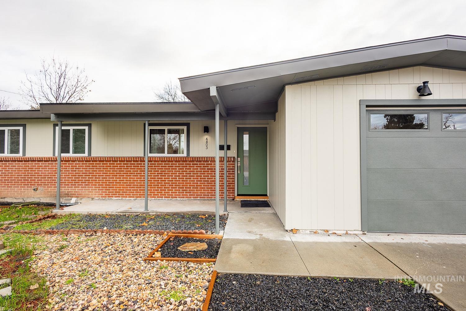 6403 Colonial Drive Boise, ID 83709 - Photo 3 of 42 Property entrance featuring brick siding and a porch