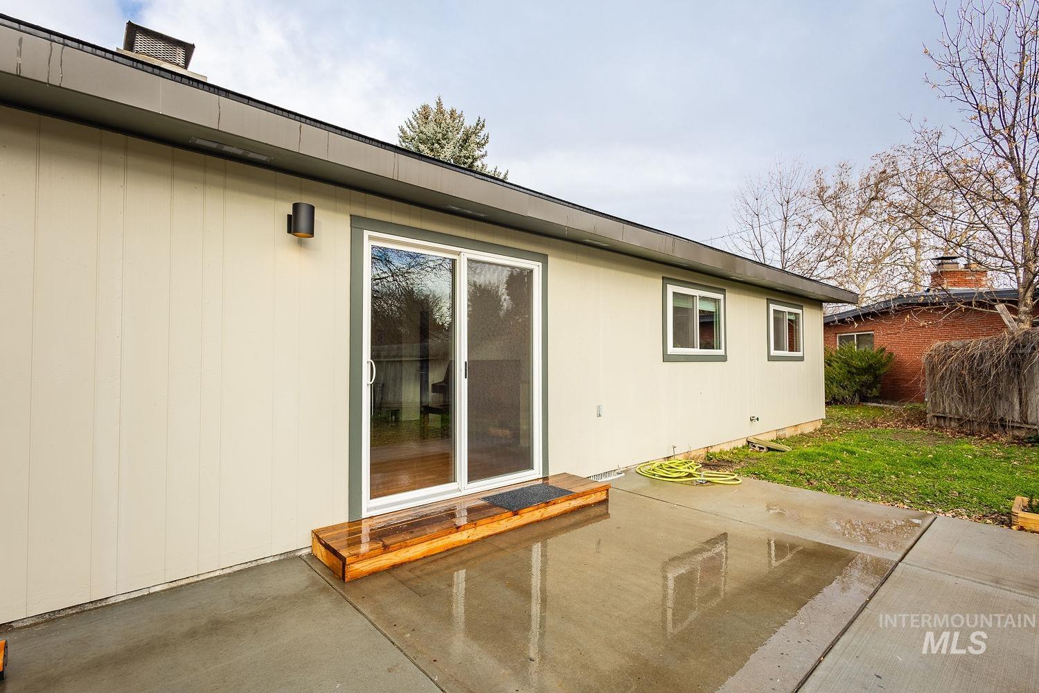 6403 Colonial Drive Boise, ID 83709 - Photo 31 of 42 Rear view of house with a patio