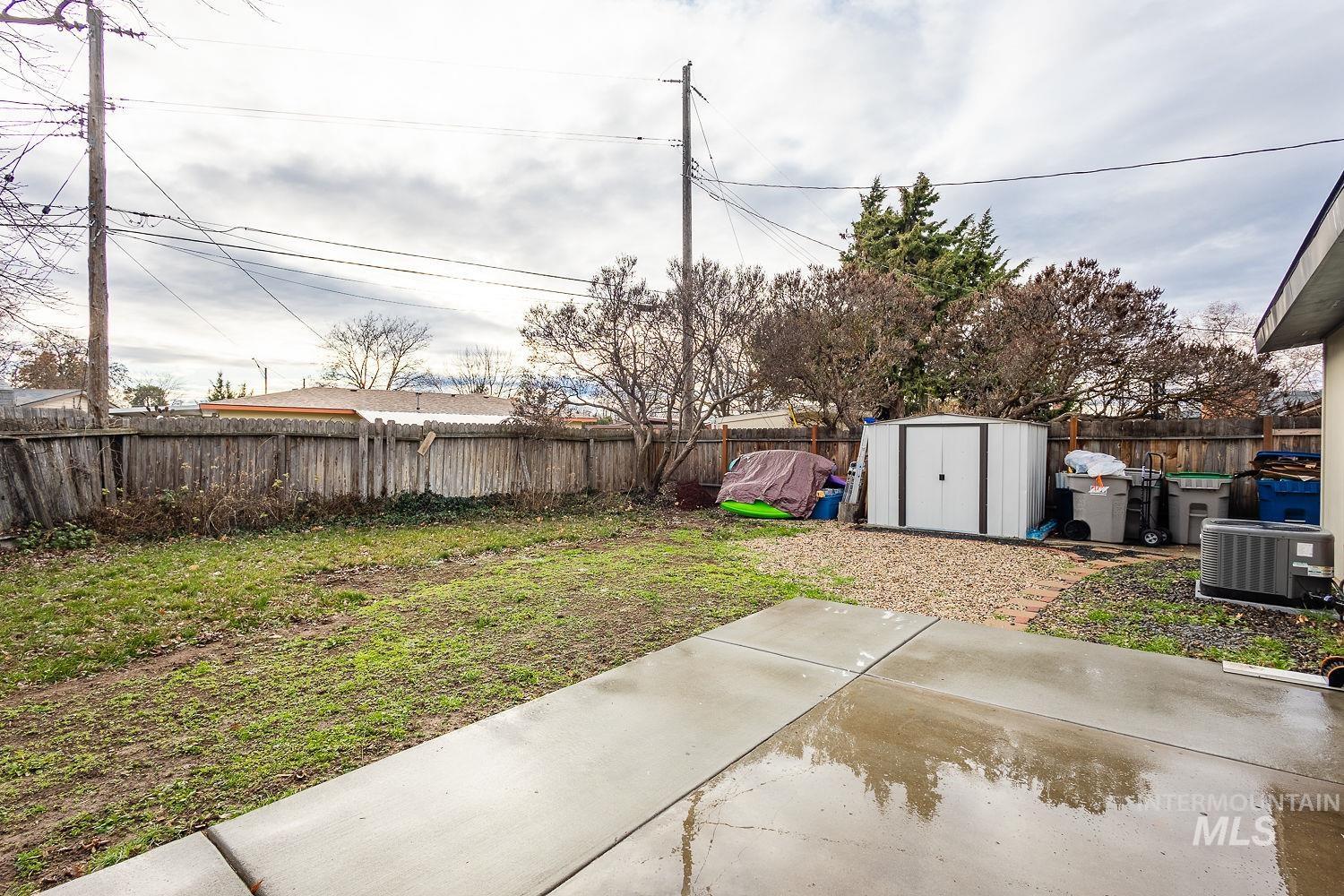 6403 Colonial Drive Boise, ID 83709 - Photo 33 of 42 Fenced backyard featuring a patio and a shed