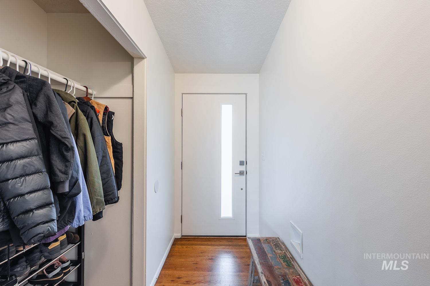 6403 Colonial Drive Boise, ID 83709 - Photo 4 of 42 Entryway featuring wood finished floors and a textured ceiling