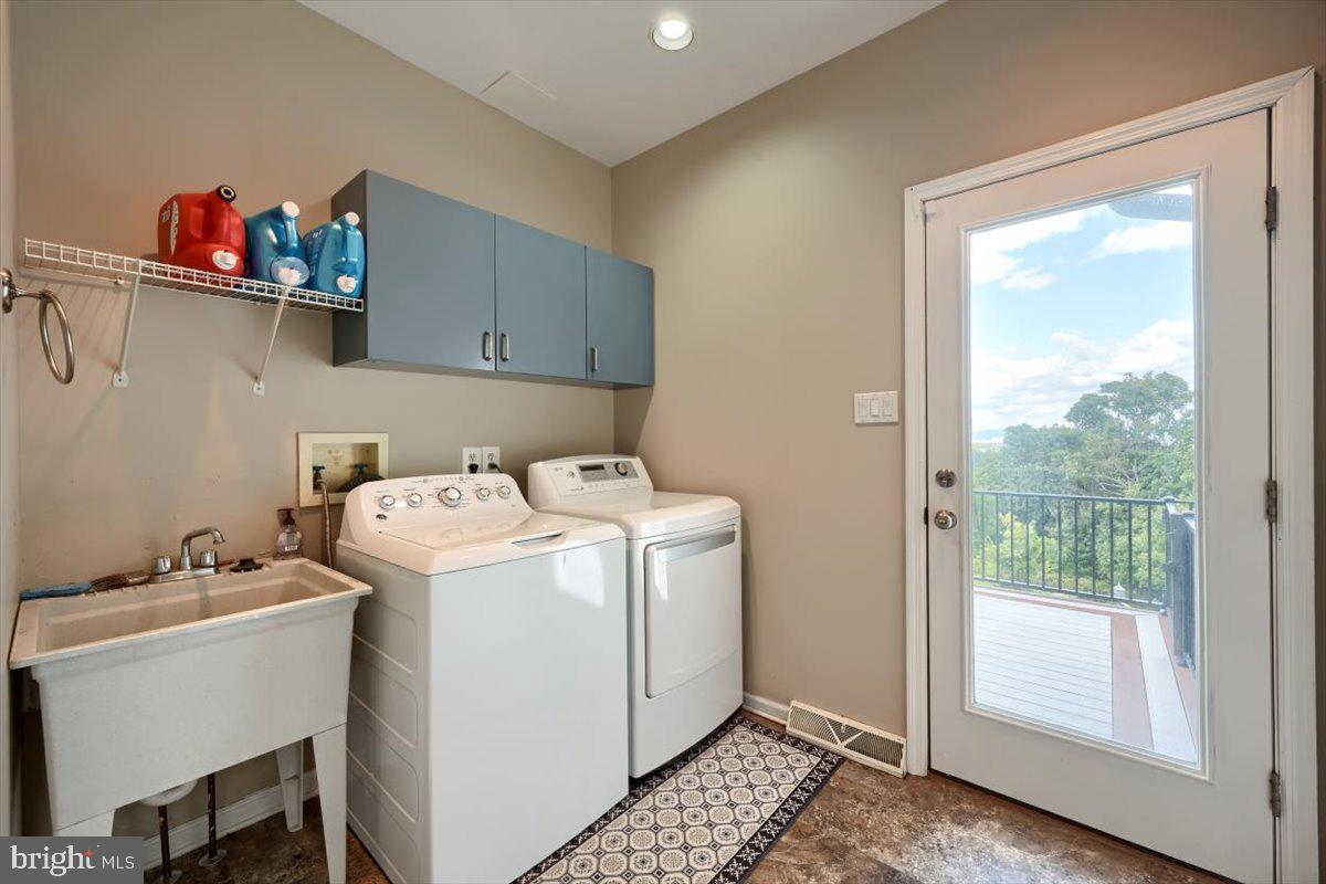 207 Hemlock Road New Cumberland, PA 17070 - Photo 23 of 51 Sunny laundry room with storage and wash sink.