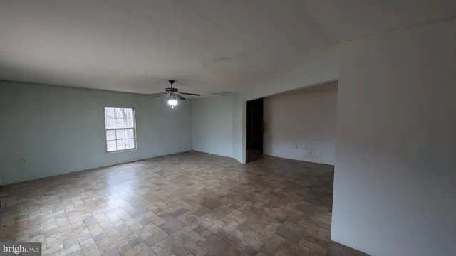 a view of an empty room and window