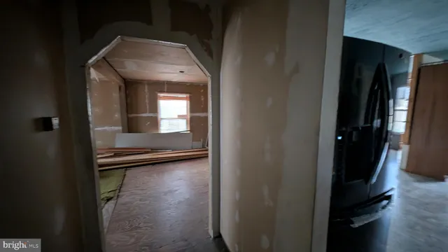 a bedroom with bed and a window