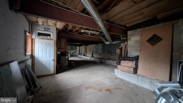 a view of a water fountain with large trees