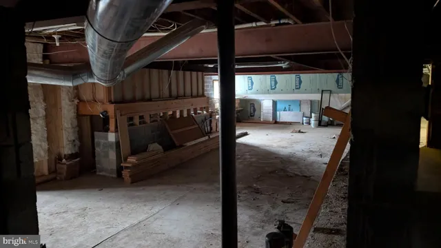 a view of backyard with a table and chairs
