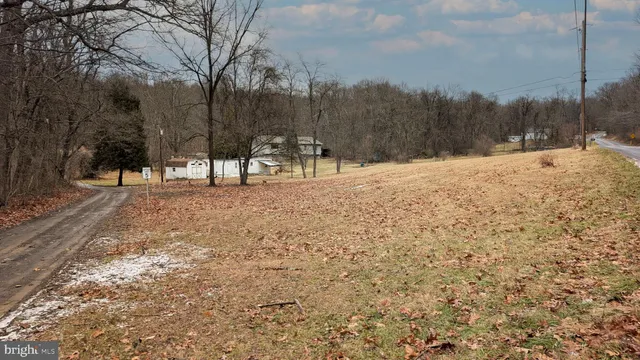 a view of snow on the side of a road
