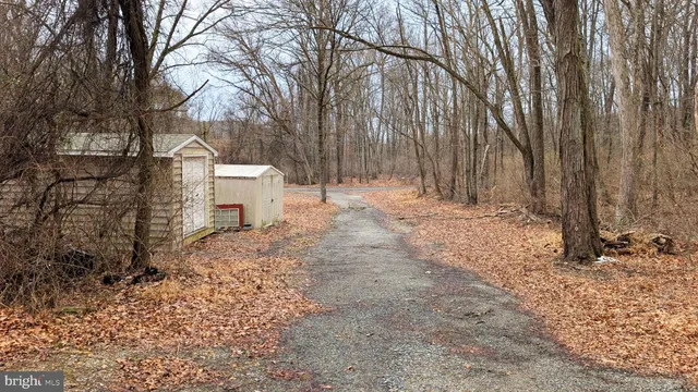 a view of a house with a snow in the yard