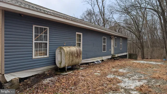 a view of a house and a yard