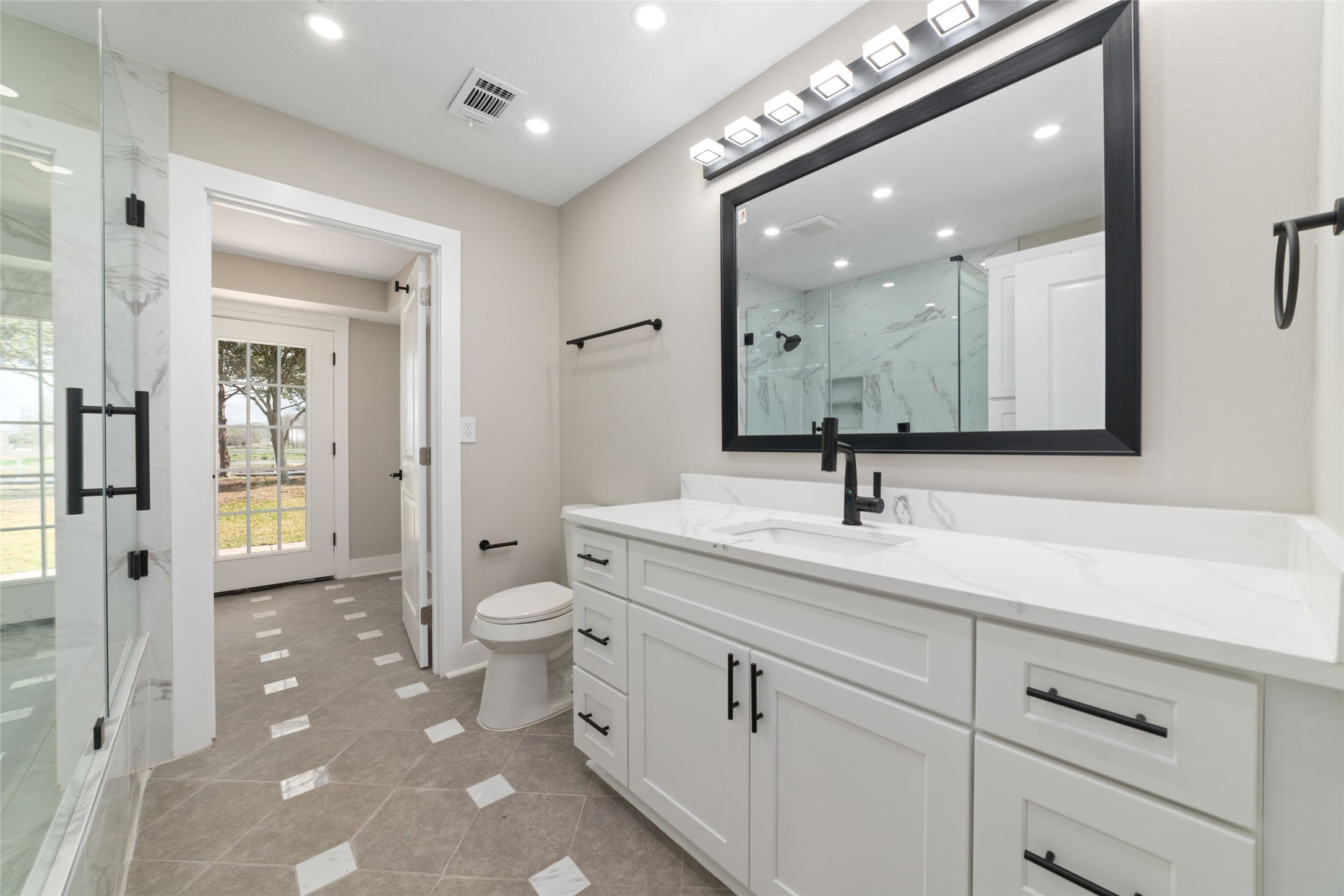 13431 Vrlla Road Guy, TX 77444 - Photo 18 of 32 a bathroom with a toilet a sink and mirror