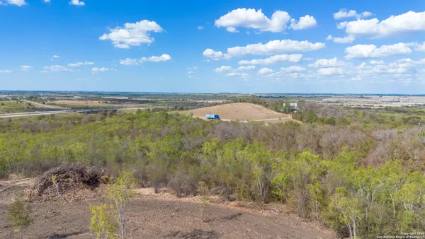 a view of a lake with houses in the back
