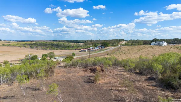 an aerial view of a yard with ocean view