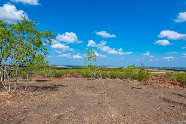 a view of a lake with a big yard