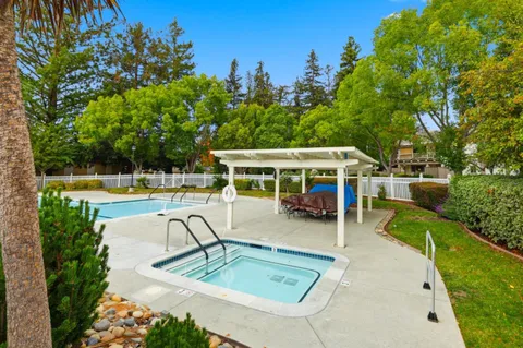 a view of a swimming pool with a patio
