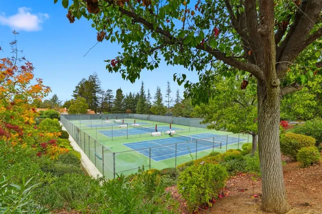 a view of an outdoor space and tennis court